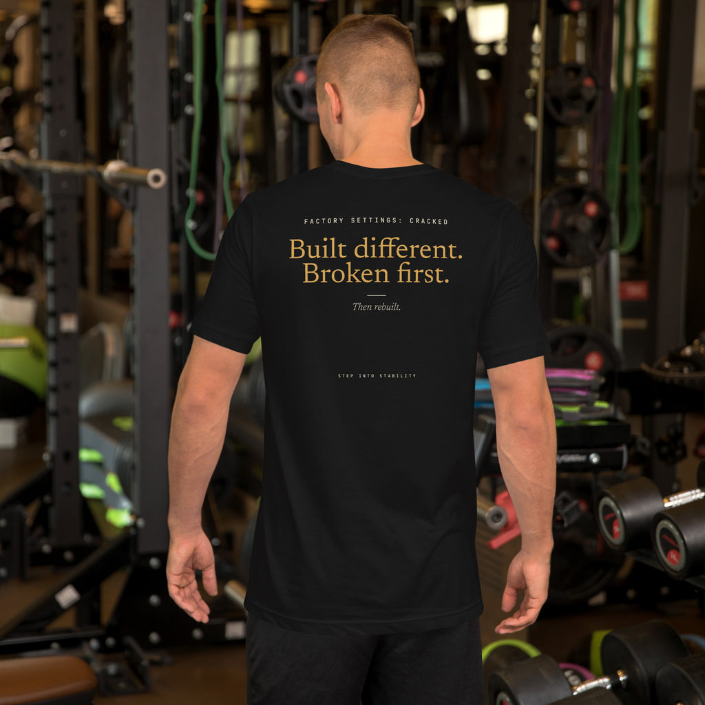 Built Different T-shirt, Black, back: Built different. Broken first. Then rebuilt.