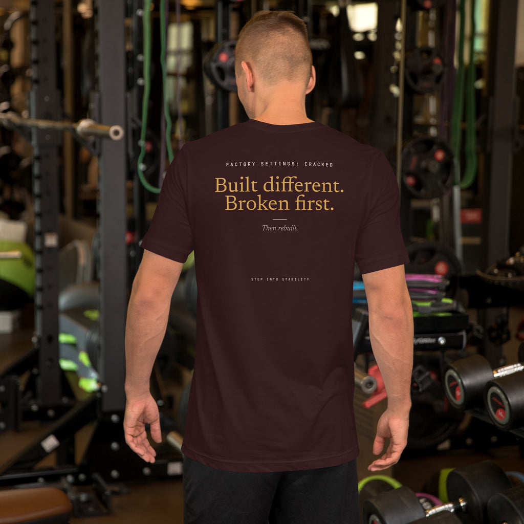 Built Different T-shirt, Oxblood Black, back: Built different. Broken first. Then rebuilt.