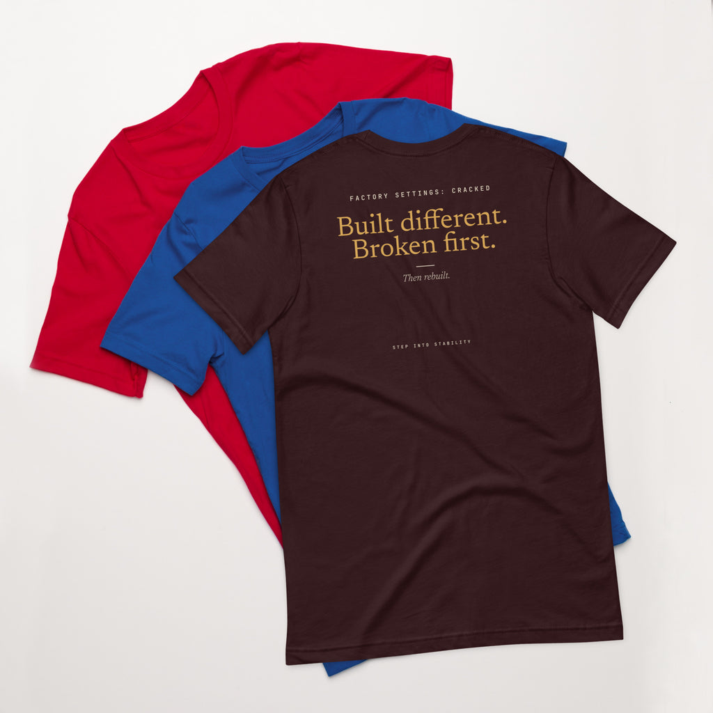 Built Different T-shirt, Oxblood Black, back: Built different. Broken first. Then rebuilt.
