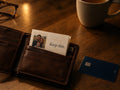 Keep This folded in a leather wallet next to a bank card, with a family photo and the words Keep this.